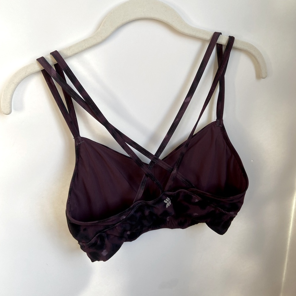 Purple and black sports bra. Crossed back Size: medium Condition: worn once
